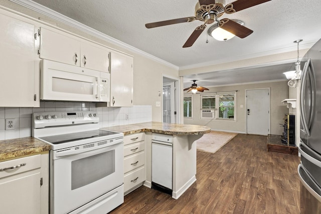 kitchen featuring a ceiling fan, dark wood finished floors, a peninsula, ornamental molding, and white appliances