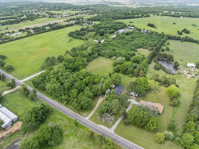 birds eye view of property featuring a rural view