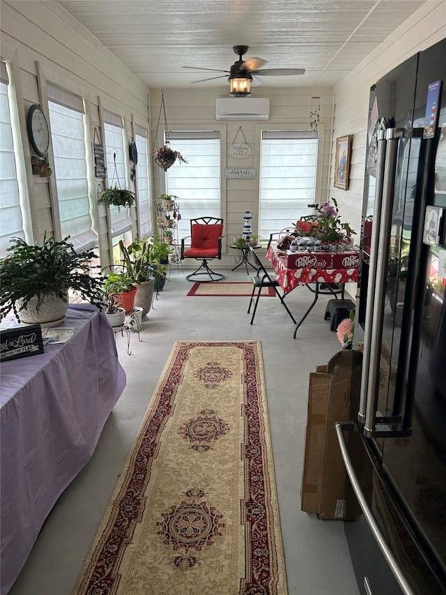 sunroom / solarium with a wall mounted air conditioner