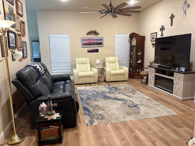 living room featuring ceiling fan and wood finished floors
