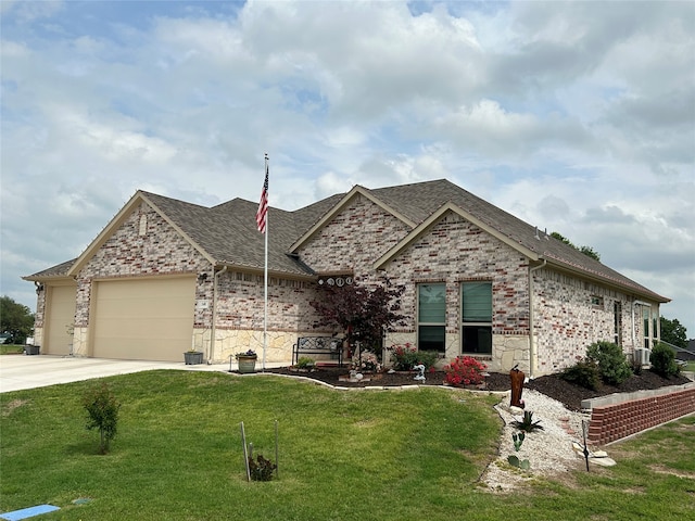 french country inspired facade with a garage, a front yard, brick siding, a shingled roof, and driveway