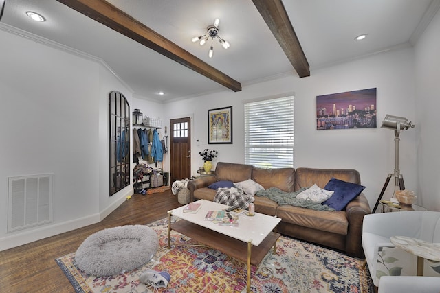living room featuring crown molding, beam ceiling, baseboards, wood finished floors, and visible vents