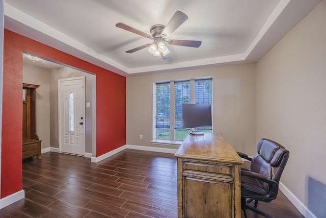 703 Athenia Way, Duncanville, TX 75137 - office area featuring a tray ceiling, baseboards, dark wood finished floors, and ceiling fan