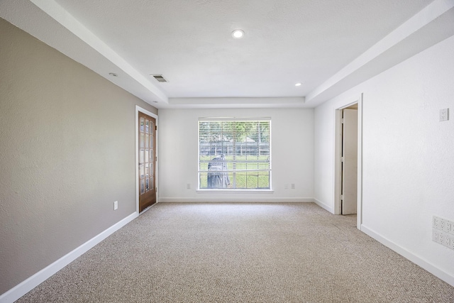 703 Athenia Way, Duncanville, TX 75137 - empty room with light carpet, baseboards, recessed lighting, and a tray ceiling