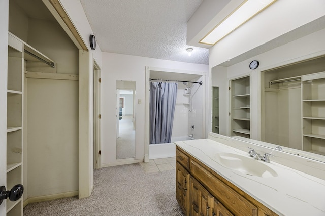 703 Athenia Way, Duncanville, TX 75137 - full bath featuring vanity, shower / bath combo, a textured ceiling, baseboards, and tile patterned flooring