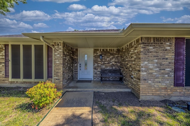 703 Athenia Way, Duncanville, TX 75137 - property entrance with brick siding and a porch
