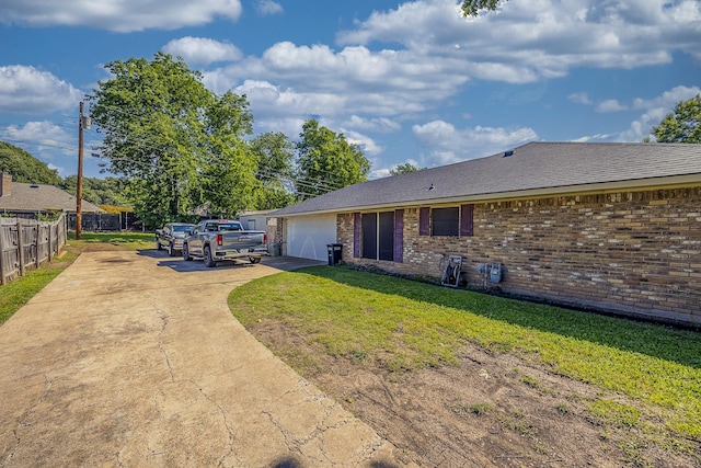 703 Athenia Way, Duncanville, TX 75137 - back of house with driveway, brick siding, and an attached garage