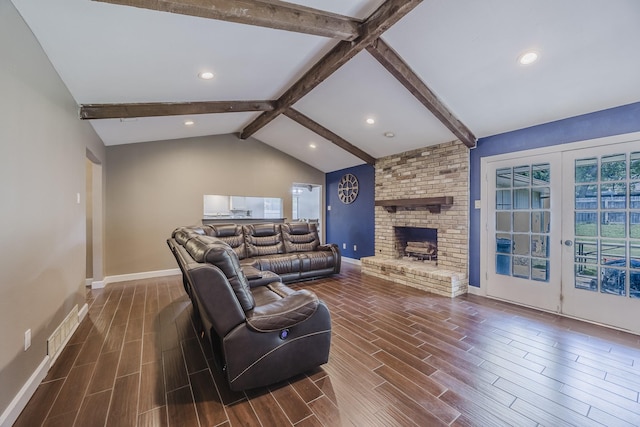 703 Athenia Way, Duncanville, TX 75137 - living room with wood finish floors, baseboards, a brick fireplace, recessed lighting, and french doors