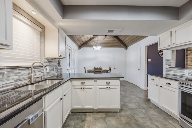 703 Athenia Way, Duncanville, TX 75137 - kitchen with a sink, appliances with stainless steel finishes, wooden ceiling, a peninsula, and white cabinets