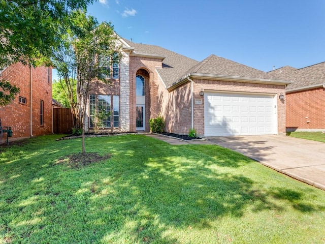 traditional home featuring driveway, brick siding, a front lawn, an attached garage, and a shingled roof
