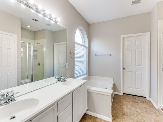 full bath featuring visible vents, a sink, and a shower stall