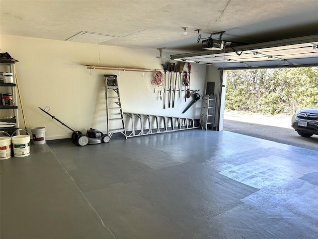 garage featuring a garage door opener