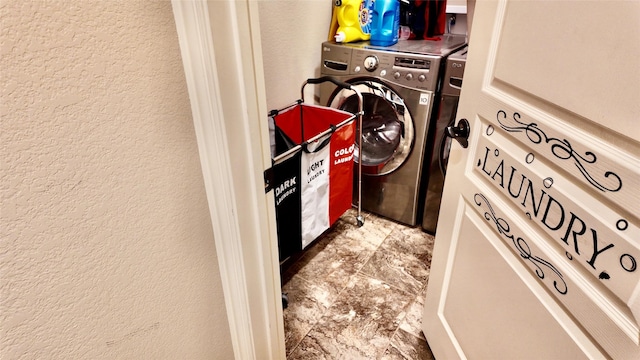 4010 Knightsbridge Ln, Midlothian, TX 76065 - laundry area featuring washer / dryer, a textured wall, and laundry area