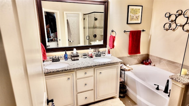 4010 Knightsbridge Ln, Midlothian, TX 76065 - full bath featuring a sink, double vanity, a shower stall, and a garden tub