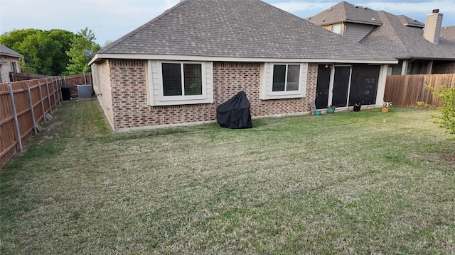 4010 Knightsbridge Ln, Midlothian, TX 76065 - back of house featuring a lawn, brick siding, a shingled roof, and a fenced backyard