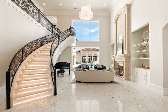 interior space featuring crown molding, a high ceiling, a fireplace, built in features, and marble finish floor