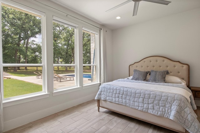 bedroom featuring recessed lighting, a ceiling fan, baseboards, and wood finished floors