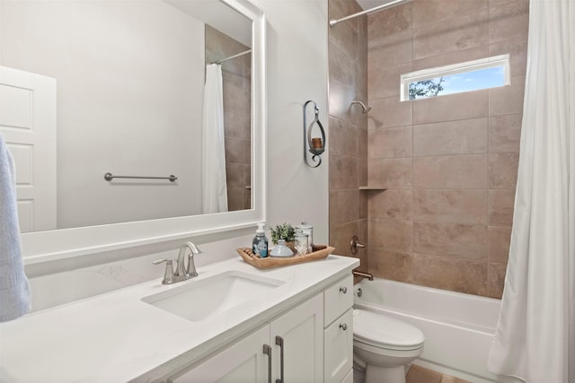 full bath with toilet, shower / bath combo, and vanity