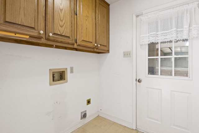 laundry area with baseboards, light floors, hookup for an electric dryer, cabinet space, and washer hookup
