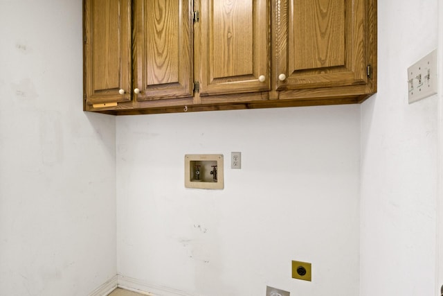 laundry area featuring cabinet space, hookup for an electric dryer, baseboards, and hookup for a washing machine