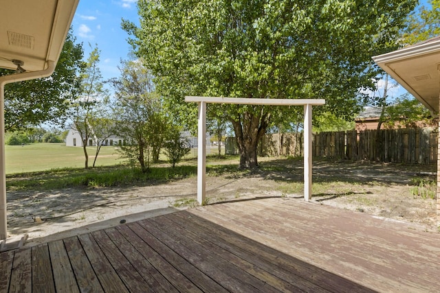 deck featuring a lawn and fence