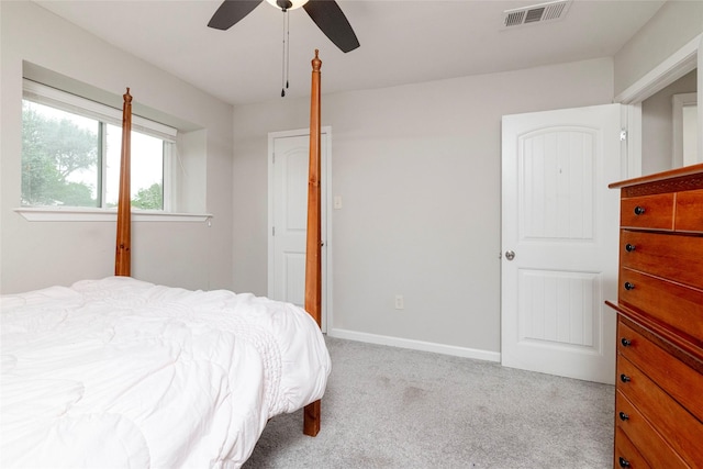 bedroom featuring baseboards, a ceiling fan, carpet flooring, and visible vents