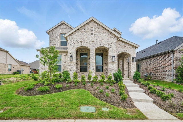 1851 Rosedale Ave, Van Alstyne, TX 75495 - french country style house featuring a front yard and brick siding