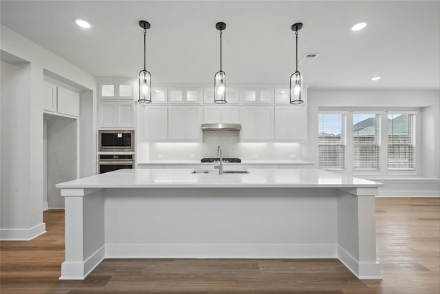1851 Rosedale Ave, Van Alstyne, TX 75495 - kitchen featuring visible vents, a sink, backsplash, light countertops, and oven