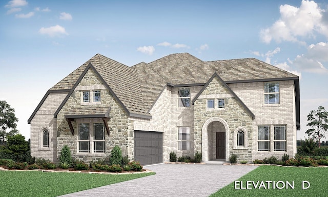 view of front of home with a front yard, driveway, and stone siding