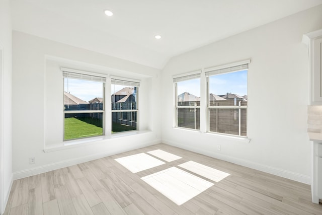 801 Daisy Corner Dr, Little Elm, TX 76227 - spare room with light wood finished floors, baseboards, recessed lighting, and vaulted ceiling