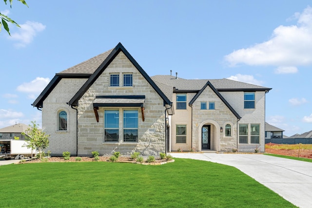 801 Daisy Corner Dr, Little Elm, TX 76227 - french country inspired facade with stone siding, a front lawn, and roof with shingles
