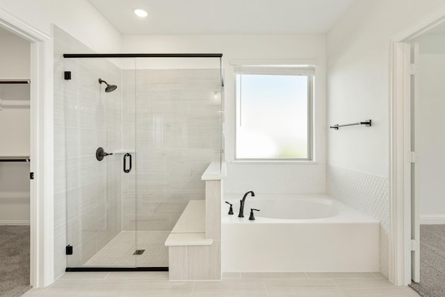 801 Daisy Corner Dr, Little Elm, TX 76227 - full bathroom featuring a shower stall, a bath, a spacious closet, and tile patterned floors