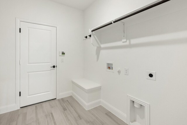 801 Daisy Corner Dr, Little Elm, TX 76227 - laundry area with hookup for a gas dryer, electric dryer hookup, washer hookup, baseboards, and light wood-type flooring