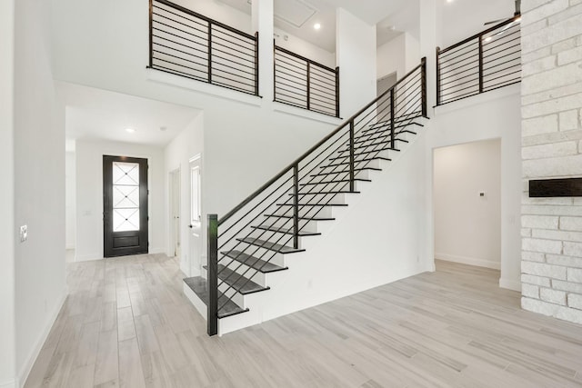 801 Daisy Corner Dr, Little Elm, TX 76227 - foyer with a high ceiling, stairway, baseboards, and wood finished floors