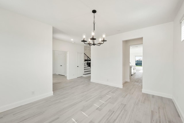801 Daisy Corner Dr, Little Elm, TX 76227 - unfurnished room featuring stairway, a chandelier, light wood finished floors, baseboards, and recessed lighting