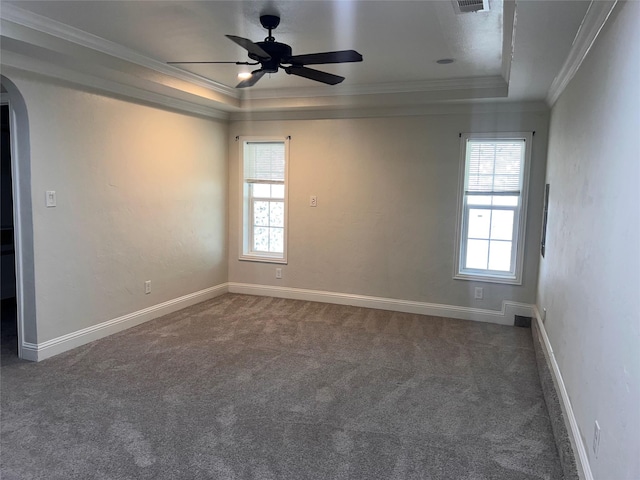 1005 Bass Dr, Plano, TX 75025 - unfurnished room with crown molding, arched walkways, carpet floors, and a tray ceiling
