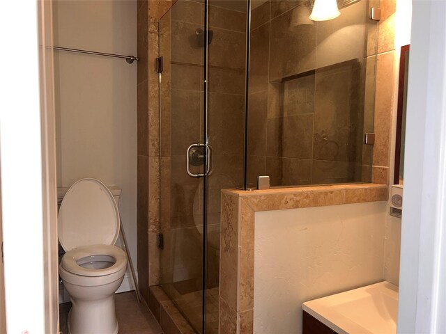 1005 Bass Dr, Plano, TX 75025 - bathroom with vanity, toilet, and a shower stall