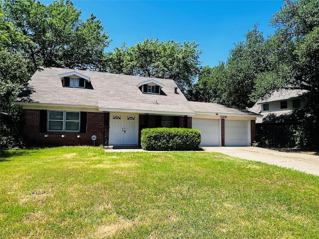 cape cod home with a front yard, brick siding, fence, concrete driveway, and an attached garage