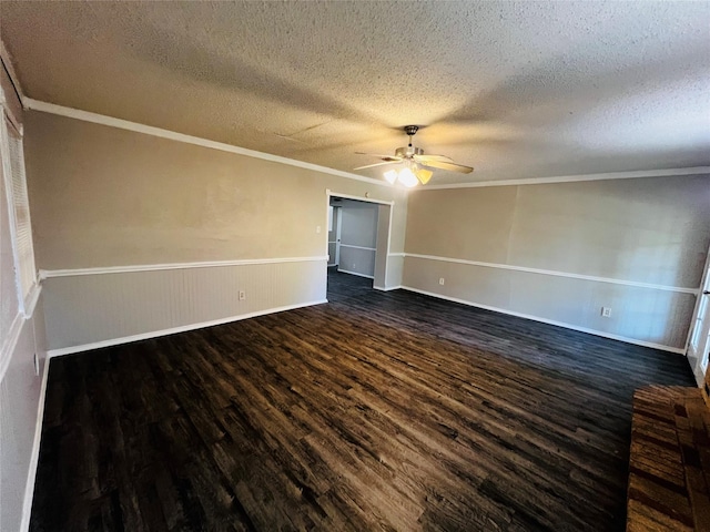 spare room featuring crown molding, a ceiling fan, a textured ceiling, and dark wood-type flooring