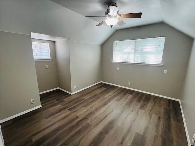 bonus room featuring baseboards, ceiling fan, wood finished floors, and lofted ceiling
