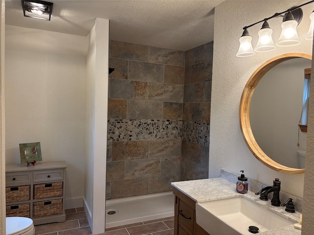 1980 SE County Road 3310th Rd, Kerens, TX 75144 - full bath with vanity, toilet, a textured ceiling, and a stall shower