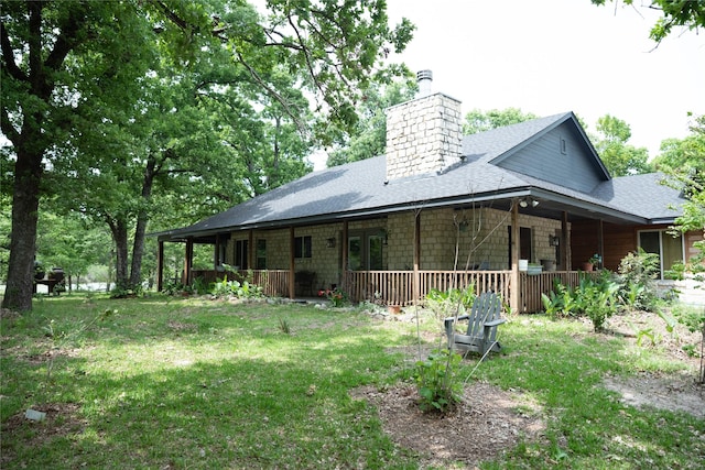 1980 SE County Road 3310th Rd, Kerens, TX 75144 - rear view of property featuring a yard, a porch, a chimney, and roof with shingles