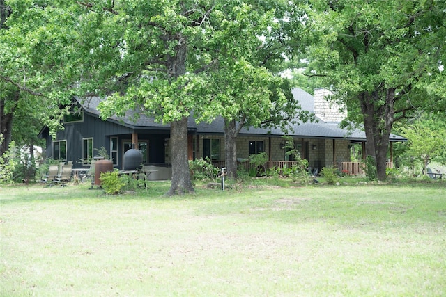 1980 SE County Road 3310th Rd, Kerens, TX 75144 - back of property featuring a shingled roof and a yard
