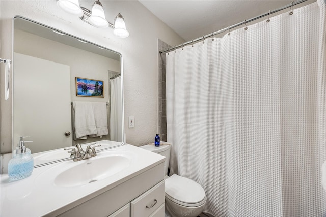 1200 Ridgeway Dr, Richardson, TX 75080 - full bath featuring vanity, a textured wall, and toilet