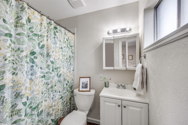 1200 Ridgeway Dr, Richardson, TX 75080 - full bath with a textured wall, vanity, toilet, a shower with shower curtain, and visible vents