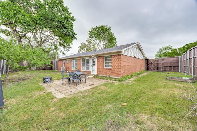 1200 Ridgeway Dr, Richardson, TX 75080 - rear view of house featuring a patio, brick siding, a fenced backyard, and a lawn