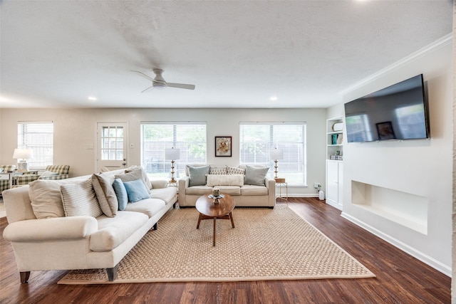 1200 Ridgeway Dr, Richardson, TX 75080 - living room with plenty of natural light, a ceiling fan, built in features, and dark wood-style floors