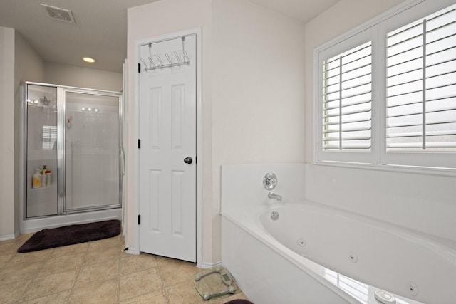 bathroom with visible vents, baseboards, a tub with jets, recessed lighting, and a stall shower