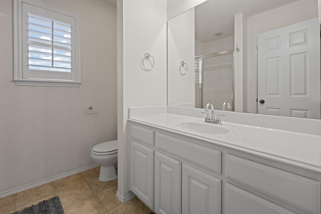 full bath featuring vanity, toilet, baseboards, tile patterned floors, and a stall shower