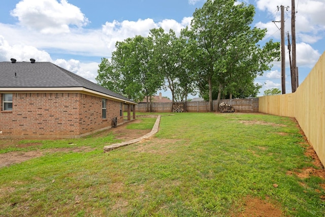 view of yard with a fenced backyard